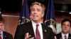 FILE - Former U.S. Rep. Joe Walsh, R-Ill., gestures during a news conference on Capitol Hill in Washington. 