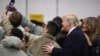 U.S. President Donald Trump and first lady Melania Trump take a selfie with U.S. troops at Ramstein Air Force Base, Germany, Dec. 27, 2018. 