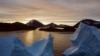 An aerial view of large Icebergs floating as the sun rises near Kulusuk, Greenland, early Aug. 16, 2019. 