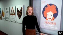 Clara Marz, an organizer of an exhibition about women, attends an interview with the Associated Press in her office in Berlin, Germany, Oct. 17, 2024.