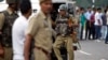 Indian paramilitary soldiers arrive at the site of a rebel attack at an army camp in Samba, about 40 kilometers (25 miles) from Jammu, India, Sept. 26, 2013