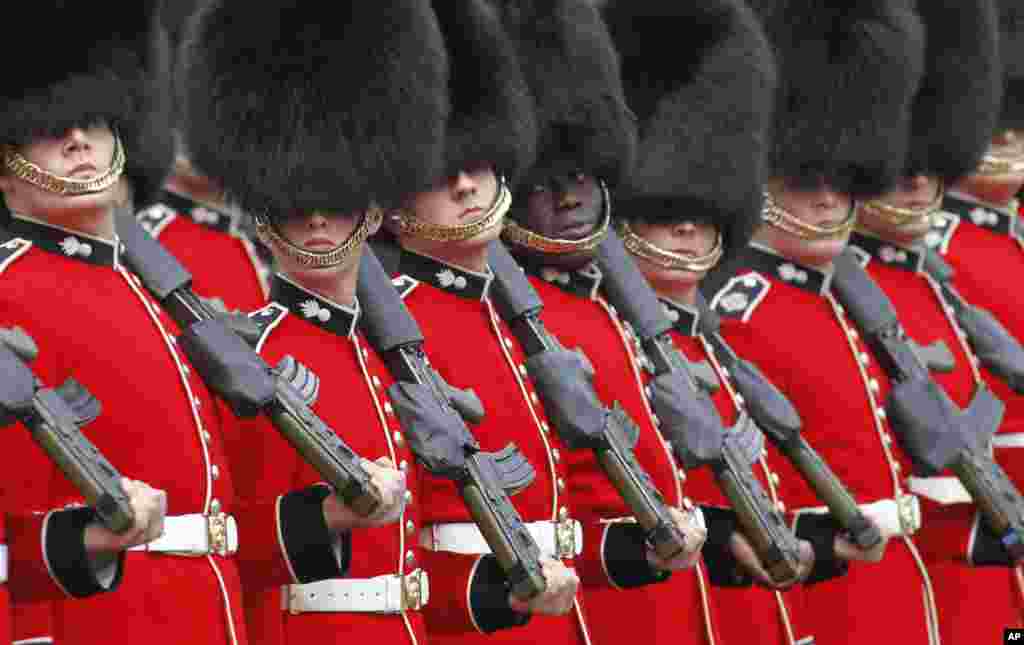 Guardsmen march onto the Mall in London to take up their positions ahead of the formal carriage procession.