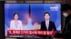 A man wearing a face mask walks past a TV screen airing reports about North Korea's firing of missiles at the Seoul Railway Station in Seoul, South Korea, Tuesday, April 14, 2020. South Korea says North Korean fighter jets have fired missiles off…