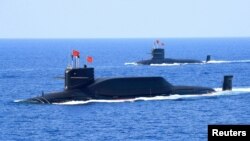 资料照：中国海军094A晋级弹道导弹战略核潜艇在南中国海参加军事表演。（2018年4月12日）