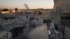 An Iraqi soldier stands atop a destroyed house in a neighborhood recently retaken by Iraqi security forces during fighting against Islamic State militants in west Mosul, Iraq, June 25, 2017.