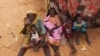 Photo released by the United Nations African Union Mission in Darfur (UNAMID) shows women and their children outside their tents at the Zam Zam refugee camp for internally displaced people (IDP) in North Darfur, Sudan, June 11, 2014.