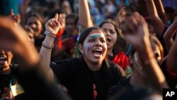 Indian women shout slogans during an event to support the "One Billion Rising" global campaign in Hyderabad, India, Feb. 14, 2013. 