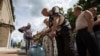 Residents collect water at a pumping station in the eastern Ukranian city of Slaviansk, June 17, 2014. Slaviansk, the pro-Russian separatist stronghold, is faced with ongoing shortages, utility outages and frequent artillery fire. 