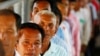 Cambodians line up at a court entrance before a hearing to prepare for the genocide trial of two surviving leaders Khieu Samphan and Noun Chea, at the U.N.-backed war crimes tribunal in Phnom Penh, file photo. 