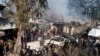 A handout picture released by the Syrian Civil Defense rescue workers shows the scene of a fuel truck explosion which killed 36 people including at least six Turkey-backed rebel fighters April 28, 2020, in the northern Syrian city of Afrin.