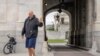 FILE - Sen. John Fetterman, D-Pa., waves to members of the media, Monday, April 17, 2023, on Capitol Hill in Washington.