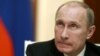 Russia's President Vladimir Putin looks on during a news conference at the Kremlin in Moscow, November 8, 2012. 