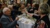 People toast with beer and raki, a traditional Turkish aniseed-based alcoholic drink, at an Istanbul restaurant, Turkey, March 16, 2013. 