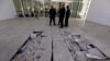 FILE - Policemen near the damaged tiles inside the Bardo museum in Tunis, March 19, 2015. 