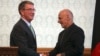 Afghan President Ashraf Ghani (R) shakes hands with U.S. Defense Secretary Ash Carter (L) after a press conference at presidential palace in Kabul, Afghanistan, Dec. 9, 2016. 