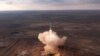 In this photo taken from video released by Roscosmos, the rocket transporting a Soyuz spacecraft carrying American Tracy Dyson, Russian Oleg Novitsky and Belarusian Marina Vasilevskaya to the International Space Station lifts off from Baikonur, Kazakhstan, on March 23, 2024.