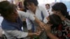 FILE - A nurse vaccinates a child against hepatitis to prevent disease in Constitucion, Chile.