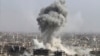 FILE - Smoke rises after shelling by the Syrian army, after Russian airstrikes, in Damascus, Syria, Oct. 14, 2015.