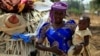 FILE - A United Nations report predicts a baby boom in Africa. Here, a woman carries her child in Nigeria's Kaduna State. 