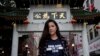 Emerson College student Frances Hui poses in the Chinatown neighborhood of Boston, Oct. 2, 2019. Hui, of Hong Kong, faced threatening language from classmates from mainland China after she published a column, "I am from Hong Kong, not China." 