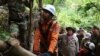 Police work to rescue Sum Bora who was trapped between rocks for almost four days in Chakry mountain jungle, Battambang province. (Facebook)