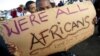 FILE - Migrants in Cape Town's Mannenberg community demonstrate against xenophobia.