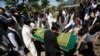 FILE - Afghans take part in a burial ceremony of journalist Zabihullah Tamanna, in Kabul, Afghanistan, June 7, 2016. According to the U.N., 11 journalists have died in 2016 while covering the Afghan conflict.
