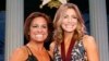 FILE - Oklahoma Hall of Fame inductee Shannon Miller, right, stands with her presenter, Mary Lou Retton, in Oklahoma City on Nov. 16, 2017. Retton. 55, is in intensive care in a Texas hospital fighting a rare form of pneumonia, according to her daughter McKenna Kelley.