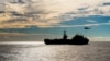 FILE - The Nimitz-class aircraft carrier USS John C. Stennis conducts a replenishment-at-sea with the dry cargo and ammunition ship USNS Charles Drew, Nov. 13, 2018.