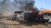 Burnout petrol tankers following a suicide attack in Maiduguri, Nigeria, March 3, 2017. Three suicide bombers set ablaze three fuel tankers in the center of Nigeria's northeastern city of Maiduguri before dawn, officials said,