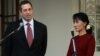 Derek Mitchell, left, U.S special envoy to Burma, talks to journalists after meeting with Burmese opposition leader Aung San Suu Kyi, right, in Rangoon, March 14, 2012.