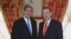 Turkish Prime Minister Recep Tayyip Erdogan, right, and US Secretary of State John Kerry shake hands as they pose for cameras before a meeting in Istanbul, Turkey, April 7, 2013. 