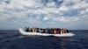Off the Libyan coast, 104 sub-Saharan Africans in a rubber dinghy await rescue. The charity Migrant Offshore Aid Station provided this courtesy photo Oct. 4, 2014. 