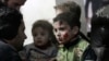 Injured children rest in a field hospital in the Duma neighborhood of Damascus, Jan. 21, 2015.